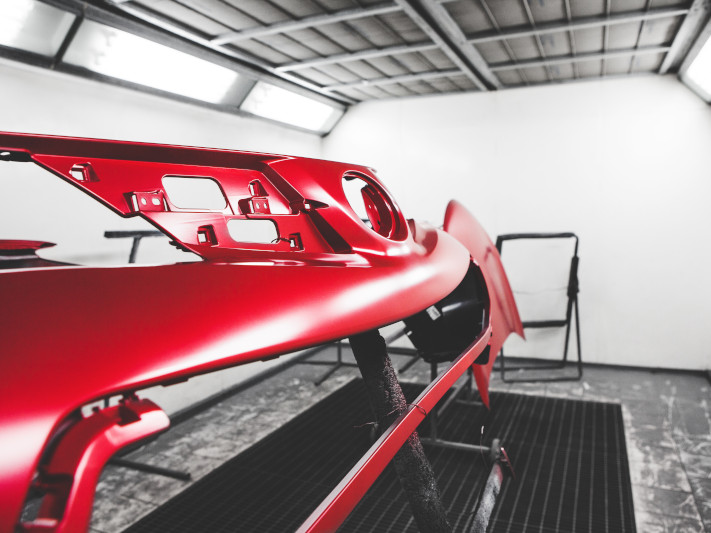 Car Body Element Being Painted In Paint Booth. Auto Body Repair.